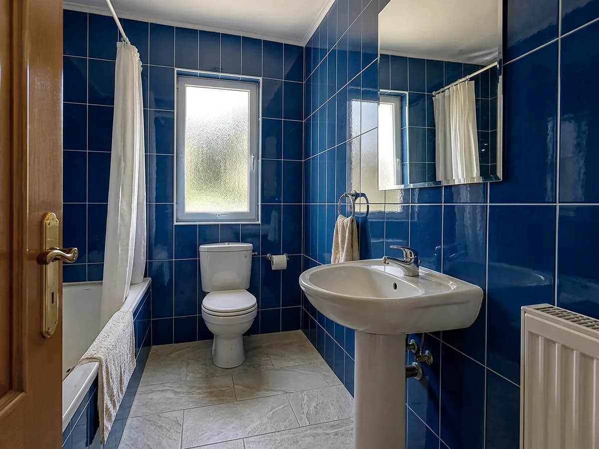 The same bathroom with Deep blue gloss tiles