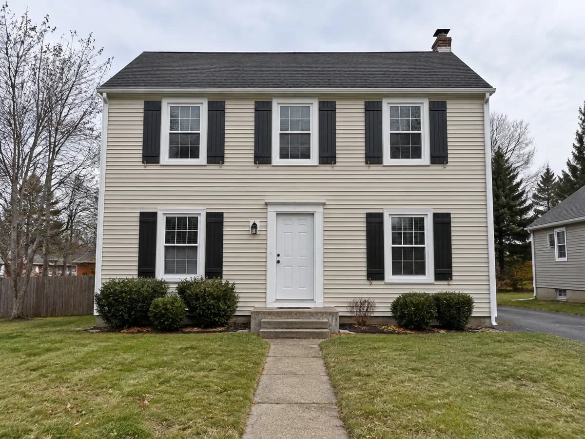 The same house — Black board & batten shutters